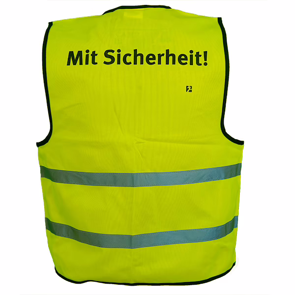Abbildung einer gelben Warnweste mir Aufdruck "Mit Sicherheit!"